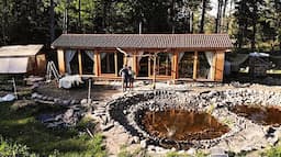 Hand-digging a pond in front of our cabin | story 34