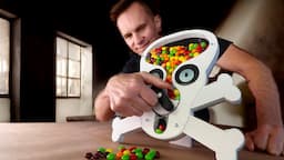 This candy dispenser spits Skittles.