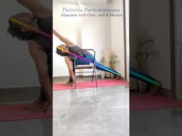 Getting deeper into Parivrtta Parsvakonasana with the yoga chair & wall #iyengaryoga #yogatutorial