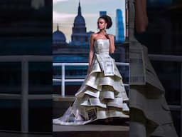 Fashion shoot featuring model dressed in haute couture gown crafted from delicate newspaper pages