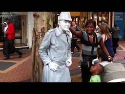 Street Artist Human Statue kicked by a boy