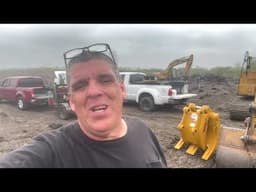 Grapple being put on a Cat Excavator