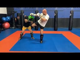 Muay Thai striking combination (1-2-elbow-double knee-rear round kick)