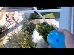 throwing water balloons at people