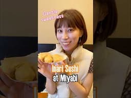 A Japanese girl shares traditional Japanese Food Inari Sushi at Miyabi in Akihabara