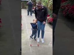 Blind Toddler explores botanical garden with belt cane!