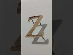 Letter Z. Trajan prismatic font. Cast bronze letters. Polished finish. Clear protective coating.