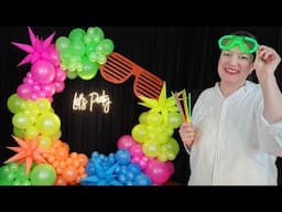 Get Ready for the MOST EPIC 80's Neon Glow Party with This DIY Balloon Garland Circle Arch Backdrop