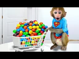 Monkey Baby Bon Bon go to supermarket to buy colorful chocolate candy and eat rainbow ice cream