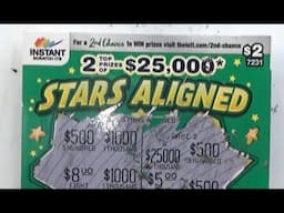 Scratching an Instant Scratch Off Lottery Ticket called "Stars Aligned" -  Australian Lotteries