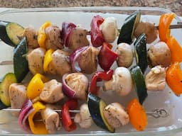 Grilled juicy and tender chicken breast kebabs. Tips & secrets on how to marinate, skewer and grill!