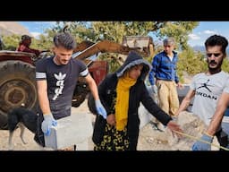 Nomadic life:building a wall for a nomadic house: friends help a nomadic couple for a block of china