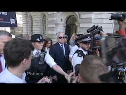 Huw Edwards runs chaotic media gauntlet to court with police escort