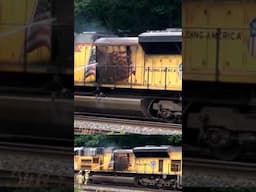 Firemen spray water on train fire.