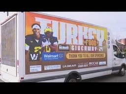 UM players Semaj Morgan and Will Johnson help with Thanksgiving turkey giveaway in Detroit