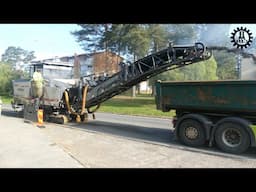 A cold milling asphalt pavement team in work with Wirtgen W210I