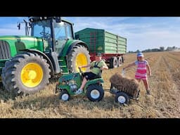 Children collect straw during harvest with a 110 mini Tractor from Nitro Motors