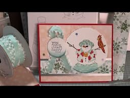 Snowman Hugs Card Tutorial by Stampin’ Up! - Snowy Scenes DSP - Card on Blue - October Card Club