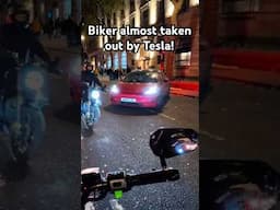 Biker almost taken out by a Tesla! #london #biker #closecall #tesla