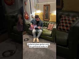 Guitarist plays guitar until his girlfriend walks in