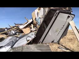 Remains of a destroyed camper trailer after it struck a police vehicle