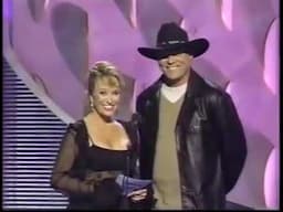 Tanya Tucker & John Michael Montgomery presenting  (CMA 1997 Duo of Year - Brooks & Dunn)