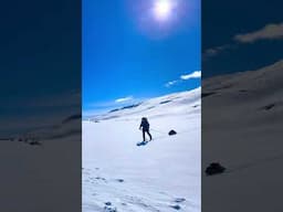 Solo ski touring and winter camping in the mountains in Norway. April 2024