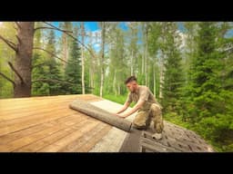 Building a house in the forest. Covered the roof with soft tiles.