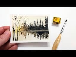 Watercolor pine tree reflection on lake painting tutorial » How to paint an evergreen landscape