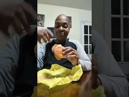 eating McChicken sandwich from McDonald's b