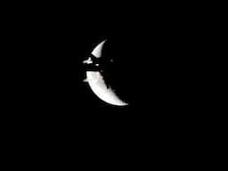 Airplane flying across the moon!