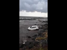 Floods Sweep Cars Out To Sea