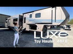 A True Four-Season Luxury Toy Hauler   #camping #rvlife #luxefifthwheel #fulltimerv #gorving