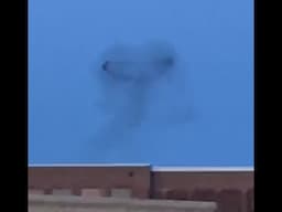 STRANGE Black Ring in Sky in Wisconsin by Lake Michigan   Is this a UFO or a Smoke Ring? What is it?