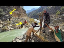 Installing a wire bridge on the river: a creative effort of a nomadic family