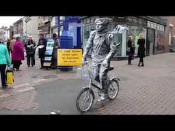 Living Statue  and bicycle    South Wales