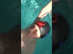 swimming backstroke with a hand spinner