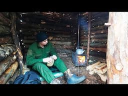 Building a warm winter shelter in the forest, survival skills